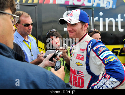 Dale Earnhardt, Jr., driver of the No. 88 National Guard Chevy, speaks to the media following his qualifying run for the AAA 400 Sept. 27, 2013, at Dover International Speedway in Dover, Del. Earnhardt earned the pole position, setting a new track record Stock Photo