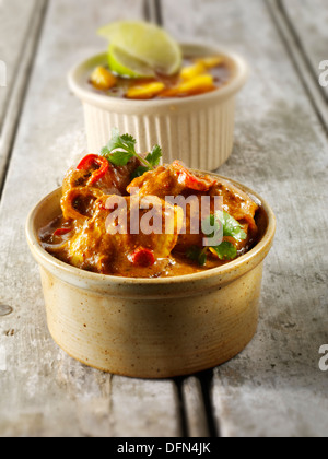 Chicken Jalfrezi, pilau rice & popodoms. Indian traditional curry. Stock Photo