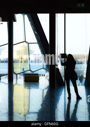 Taking pictures inside The Harpa Concert Hall and Conference Center, Reykjavik, Iceland Stock Photo