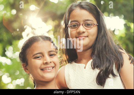 Portrait of two girls smiling, close-up Stock Photo - Alamy
