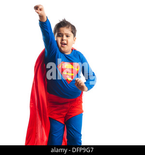 Boy dressed as a superman flying Stock Photo