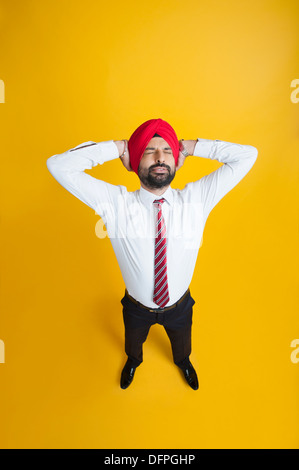 High angle view of a businessman looking tired Stock Photo