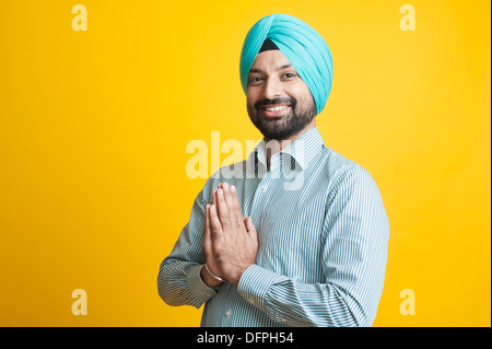 Portrait of a Sikh man greeting with smile Stock Photo