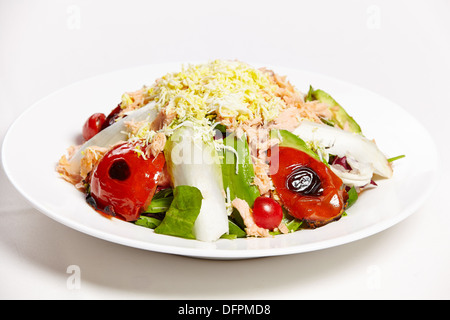 Salad of salmon pink with sautéed vegetables and a sprinkling of parmesan cheese Stock Photo