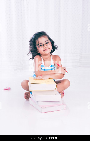 Cheerful girl sitting barefoot near the brick wall Stock Photo - Alamy