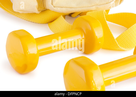 Two yellow dumbbells with yellow sport bag isolated on white with shadows Stock Photo