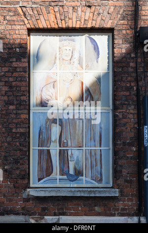 Painting on a window of a historic building on Purfleet Quay, Kings Lynn, Norfolk, UK Stock Photo