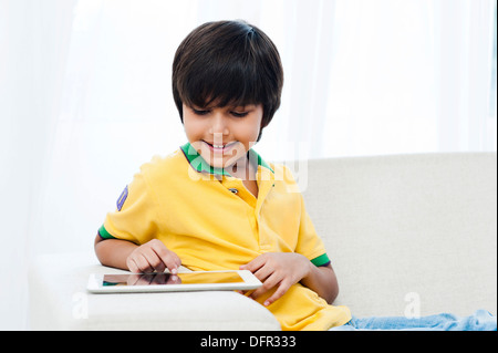 Boy using a digital tablet Stock Photo