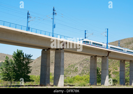 view of a high-speed train crossing a viaduct in Bubierca, Saragossa, Aragon, Spain; AVE Madrid Barcelona Stock Photo