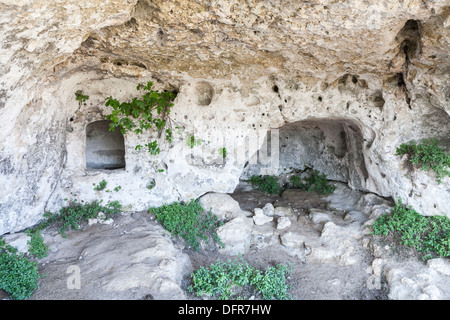Interior of typical primitive troglodyte sassi cave dwelling in Matera, Basilicata, southern Italy, European City of Culture 2019 Stock Photo