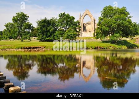 The ruins of Bolton Priory reflected in the River Wharfe, Bolton Abbey, Yorkshire Dales National Park, England Stock Photo