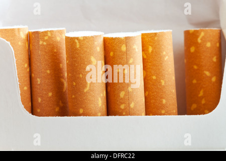cigarette filters in cardboard cigarette pack close up Stock Photo