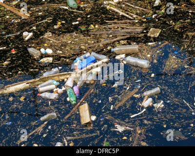 Water pollution. Garbage floating on the surface of the river Stock ...