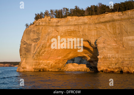 A natural arch in the Pictured Rocks as seen from a tourboat in the Pictured Rocks National Seashore near Munising. Stock Photo