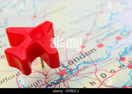 Map Of UK With Push Pin Plane Over London Stock Photo