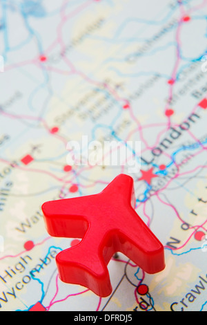 Map Of UK With Push Pin Plane Over London Stock Photo