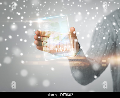 man holding transparent phone or tablet pc Stock Photo