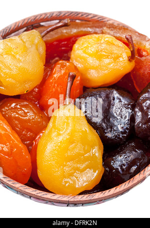 armenian sugared sweet fruits in ceramic bowl isolated on white background Stock Photo