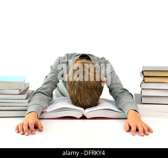 Tired and bored boy sleeping among the books Stock Photo