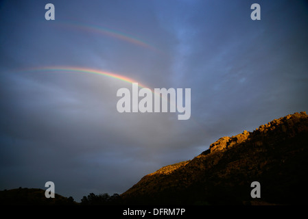 A double rainbow is seen along the Arizona Trail, Mount Lemmon, Tucson, Arizona, USA. Stock Photo