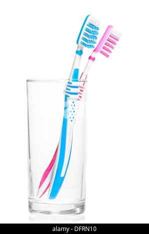 pair of new toothbrushes in a glass on a white background Stock Photo