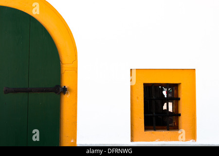 small window and door with yellow border Stock Photo