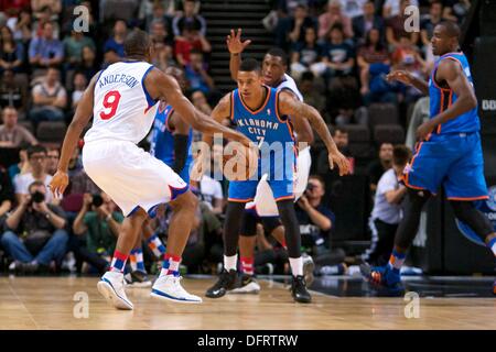 Manchester, UK. 08th Oct, 2013. Philadelphia 76ers guard James Anderson and Oklahoma City Thunder guard Diante Garrett during the NBA Basketball game between Oklahoma City Thunder and Philadelphia 76ers from the Manchester Arena. © Action Plus Sports/Alamy Live News Stock Photo
