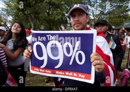 Washington DC, USA. 8th October 2013. Man holding 99% sign at Immigration reform rally. Credit:  B Christopher/Alamy Live News Stock Photo