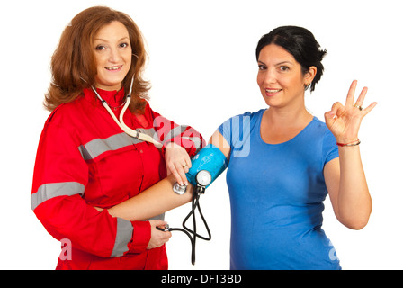 Doctor woman measure blood pressure to patient woman and it is okay Stock Photo