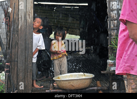 Cambodian family at home in Tonle Sap Lake village in Cambodia. Stock Photo