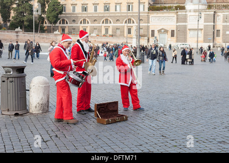 Street musicians with Santa Claus costumes in Rome, Italy Stock Photo