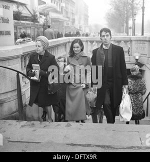 Parisians leave the Metro station at Avenue de Champs-Elysees in Paris, France, in November 1970. Photo: Wilfried Glienke Stock Photo