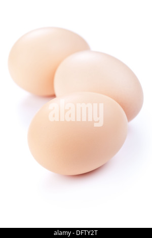 Three eggs on white background. Fresh chicken eggs Stock Photo