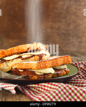 French Toast with Sliced Bananas and Chocolate Cream Nutella . Selective focus Stock Photo