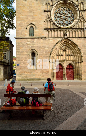 Pilgrims on The Way of St James  resting outside the Cathederal of Saint-Etienne in Cahors Stock Photo