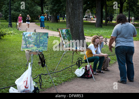 Artists painting, St Issac's cathedral, Admiralty Gardens, St. Petersburg, Russia Stock Photo
