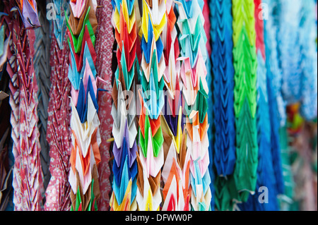 Origami cranes at Fushimi Inari Shrine in Kyoto, Japan Stock Photo