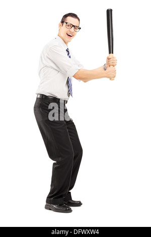 Full length portrait of a person with a baseball bat prepared to strike Stock Photo