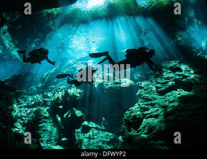 Diver enters the cavern system at Chac Mool cenote in the Riviera Maya area of Mexico's Yucatan Peninsula. Stock Photo