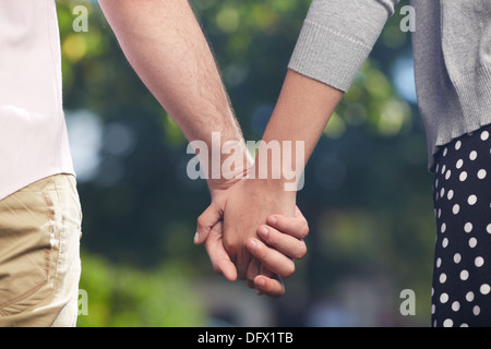Conceptual image of female and male hands together Stock Photo