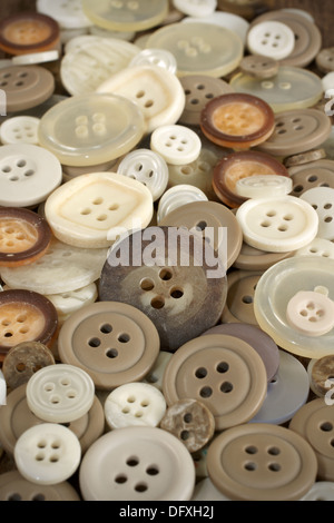 Stack of old fashioned brown beige and white buttons Stock Photo