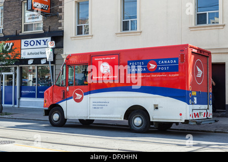 Canadian Postal delivery - Red white and blue van delivering mail for Canada post Stock Photo