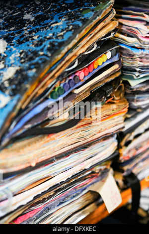 A pile of scrap books, decorated art sketch pads,with text and color,colour, full to bursting Stock Photo