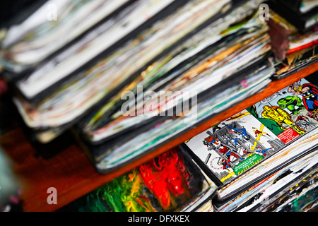 A pile of scrap books, decorated art sketch pads,with text and color,colour, full to bursting Stock Photo