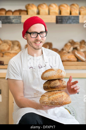 An independent high street shop - the East Bristol Bakery, Owner and Head Baker Alex Poulter Aug 2013 Stock Photo