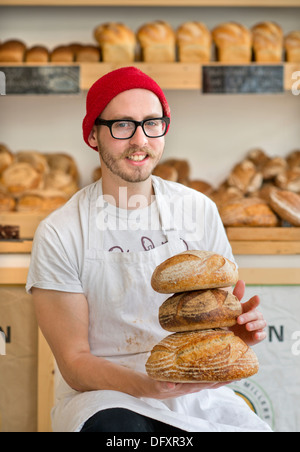 An independent high street shop - the East Bristol Bakery, Owner and Head Baker Alex Poulter Aug 2013 Stock Photo