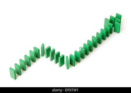 Ascending line graph formed by dominos Stock Photo