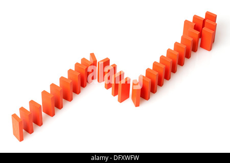Ascending line graph formed by dominos Stock Photo
