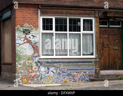 Corner house with small mosaic tiles on red brick exterior Bourne End Bucks UK Stock Photo