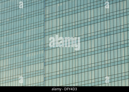 Clouds reflected in windows of modern office building Stock Photo - Alamy
